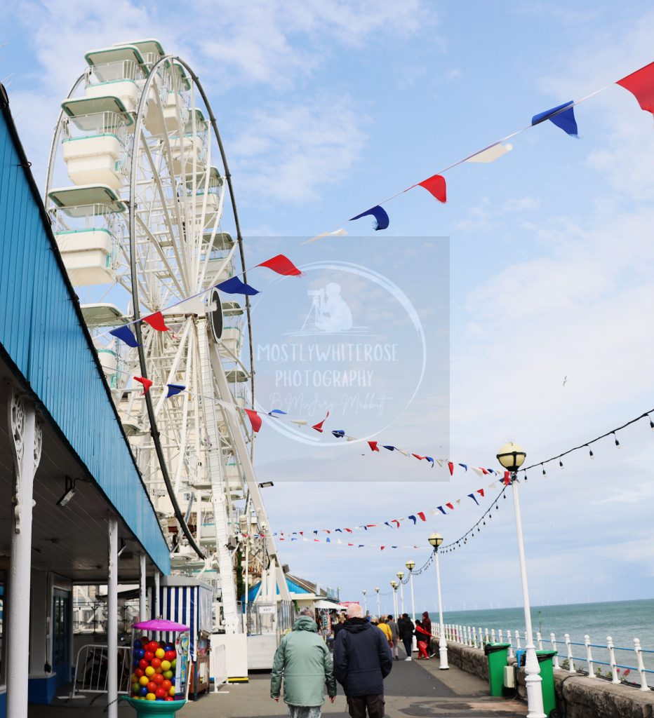 red white blue bunting pier llandudno pier big wheel couple
