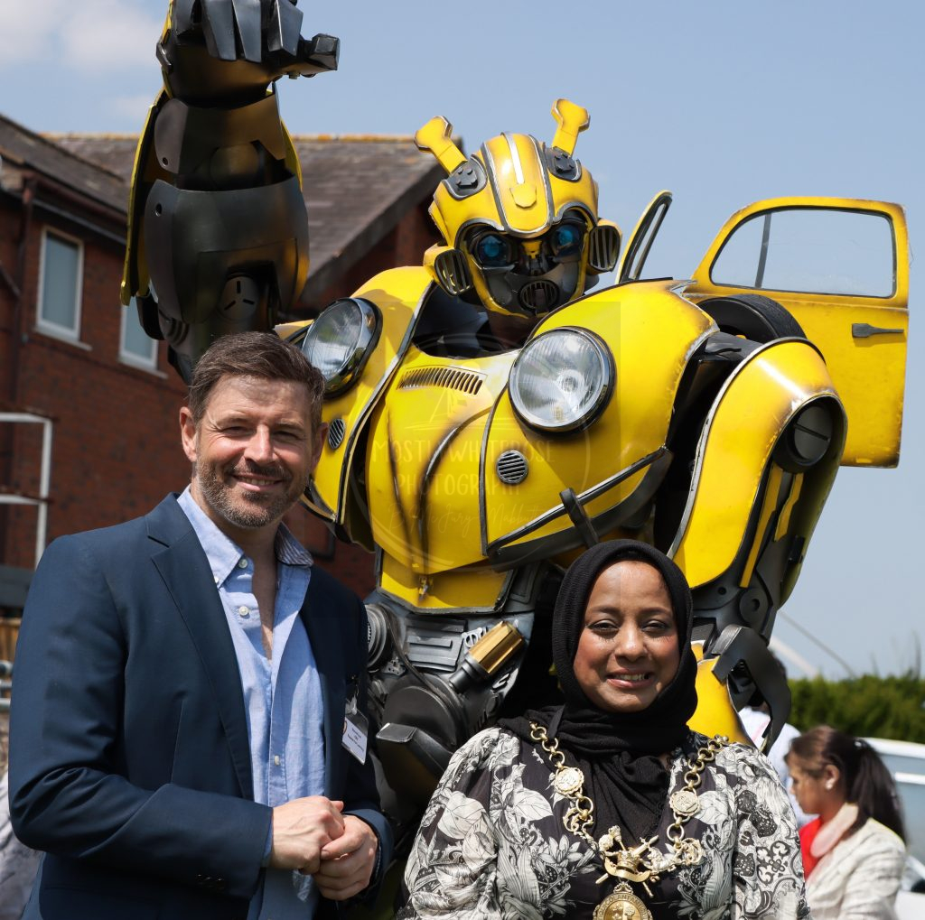 Passion for Learning CEO Steve Finch, Chester Mayor Sherin Akhtar, and Bumblebee