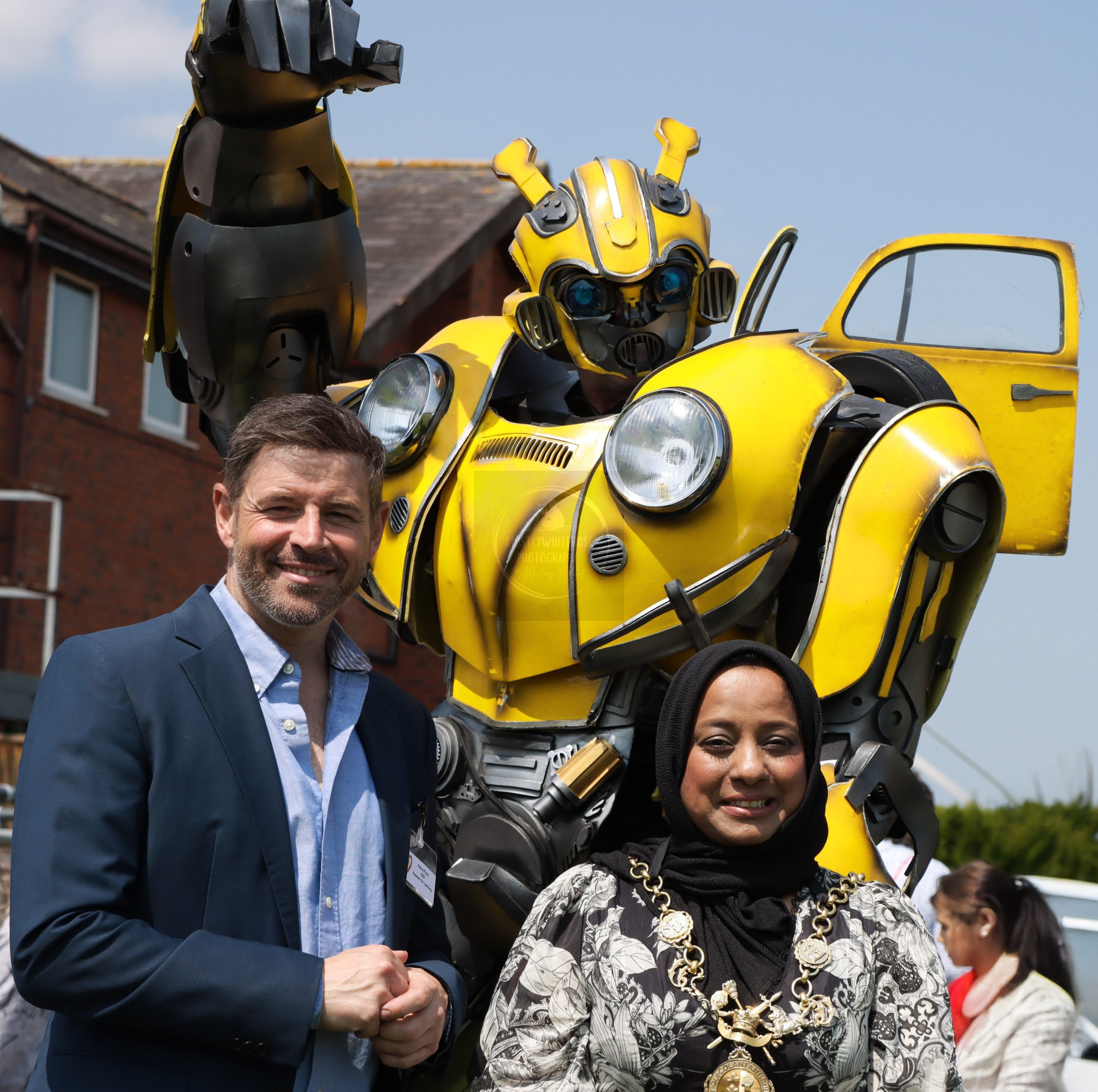 Passion for Learning CEO Steve Finch, Chester Mayor Sherin Akhtar, and Bumblebee